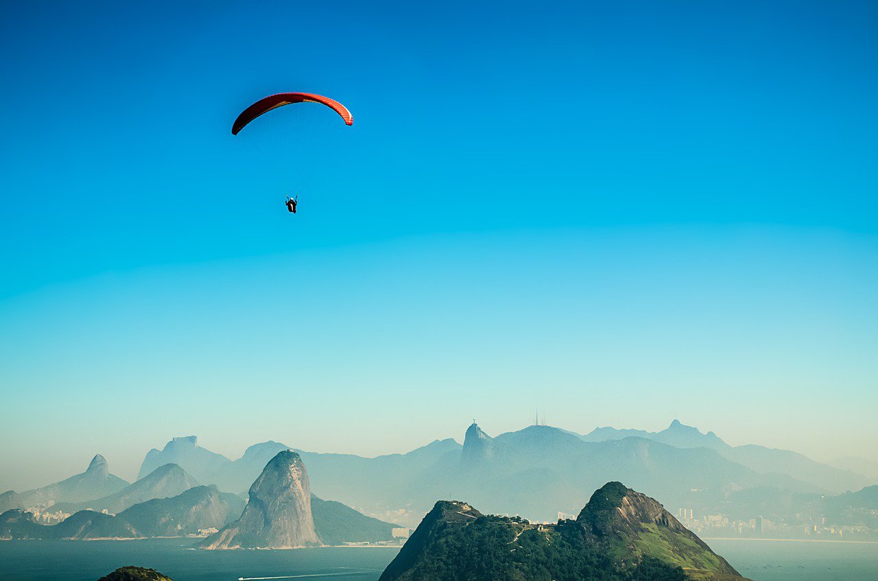 a retiree paragliding - an activity on their retirement bucket list